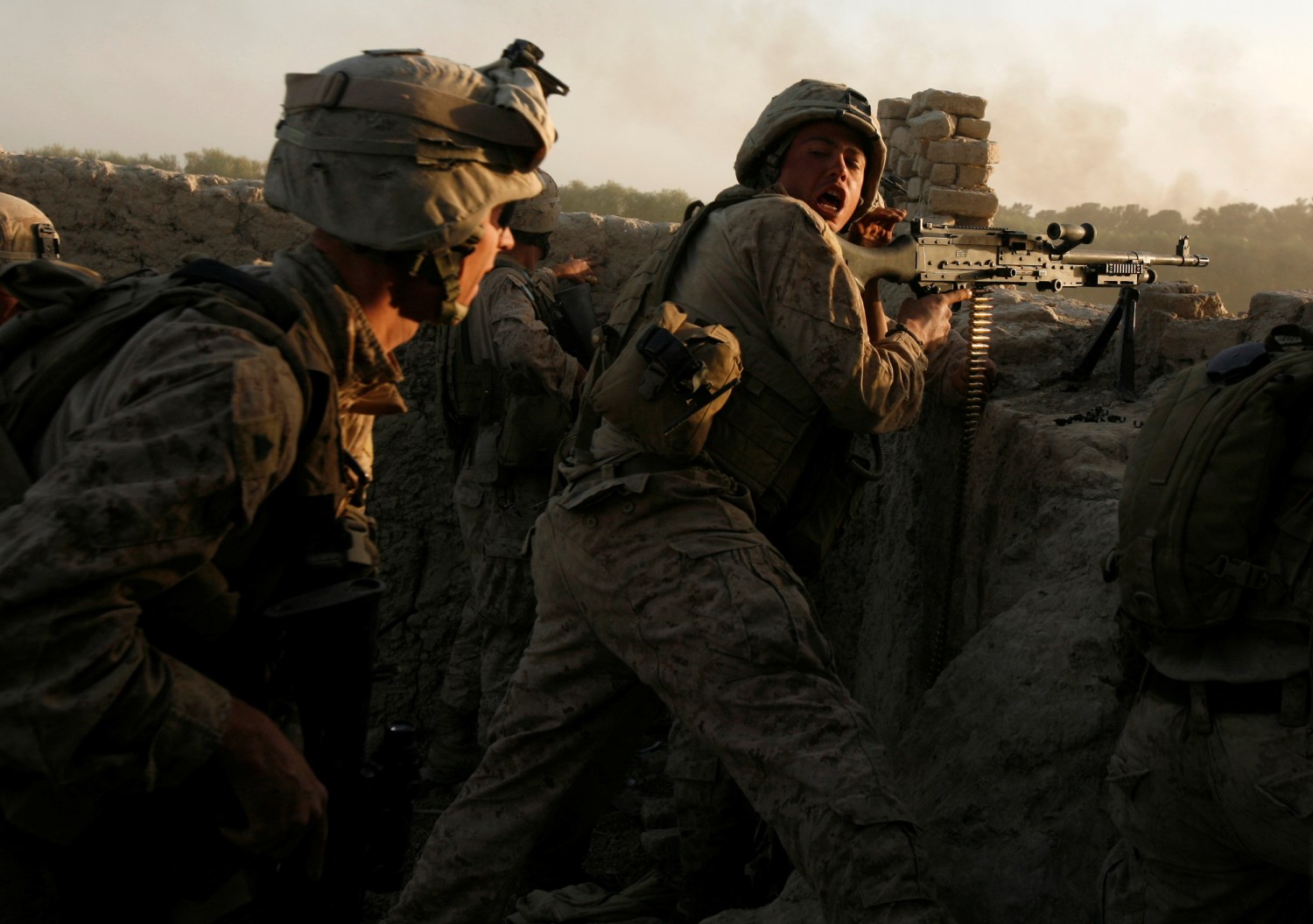 FILE PHOTO: U.S. Marines fire during a Taliban ambush as they carry out an operation to clear an area in Helmand province, Afghanistan, October 9, 2009. REUTERS/Asmaa Waguih/File Photo