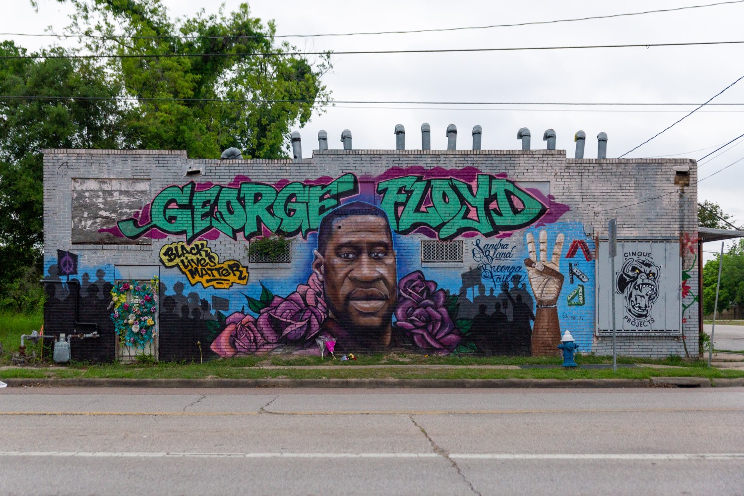 A mural of George Floyd is seen on a wall in his hometown of Third Ward, TX.