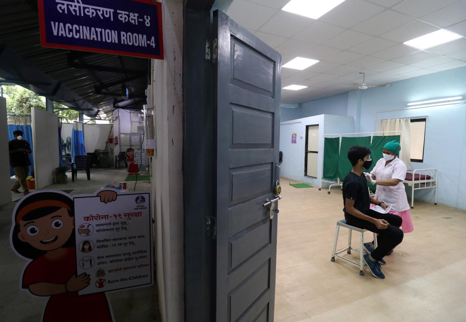 Person receives their first dose of a COVID-19 vaccine in Mumbai, India.