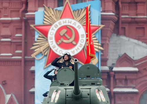 Russian service members drive T-34 Soviet-era tanks during a military parade on Victory Day, which marks the 76th anniversary of the victory over Nazi Germany in World War Two, in Red Square in central Moscow, Russia May 9, 2021. REUTERS/Maxim Shemetov