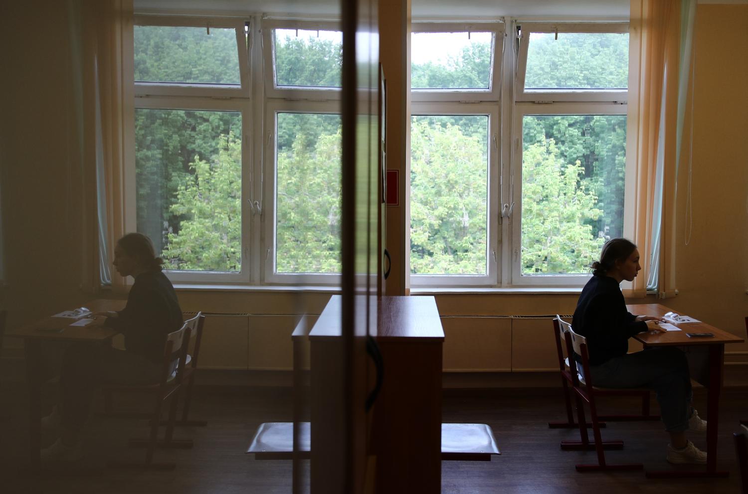 MOSCOW, RUSSIA  MAY 31, 2021: A student sits in a classroom before a Unified State Exam (EGE) in literature at Secondary Comprehensive School No 2097. The Unified State Exam is a series of graduation exams for secondary school students, which also serves as preliminary exam in universities. Sergei Bobylev/TASS.No use Russia.