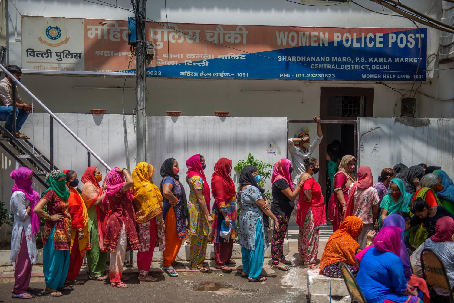 Sex workers wait in a queue to receive free rations at G B Road, kamla market during the distribution.Under the programme 'Seva Hi Sangathan' BJP (Bharatiya Janata Party) is distributing free food rations across India, helping those in need amid Coronavirus crisis. (Photo by Pradeep Gaur / SOPA Images/Sipa USA)No Use Germany.