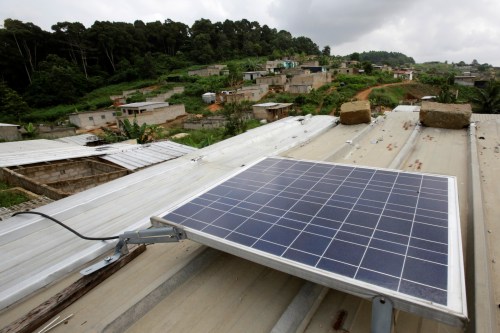 A solar panel is pictured on the roof of Jean-Noel Kouame's house, on the outer limits of the main city Abidjan's vast urban sprawl, Ivory Coast  December 18, 2017. Picture taken December 18, 2017. REUTERS/Thierry Gouegnon
