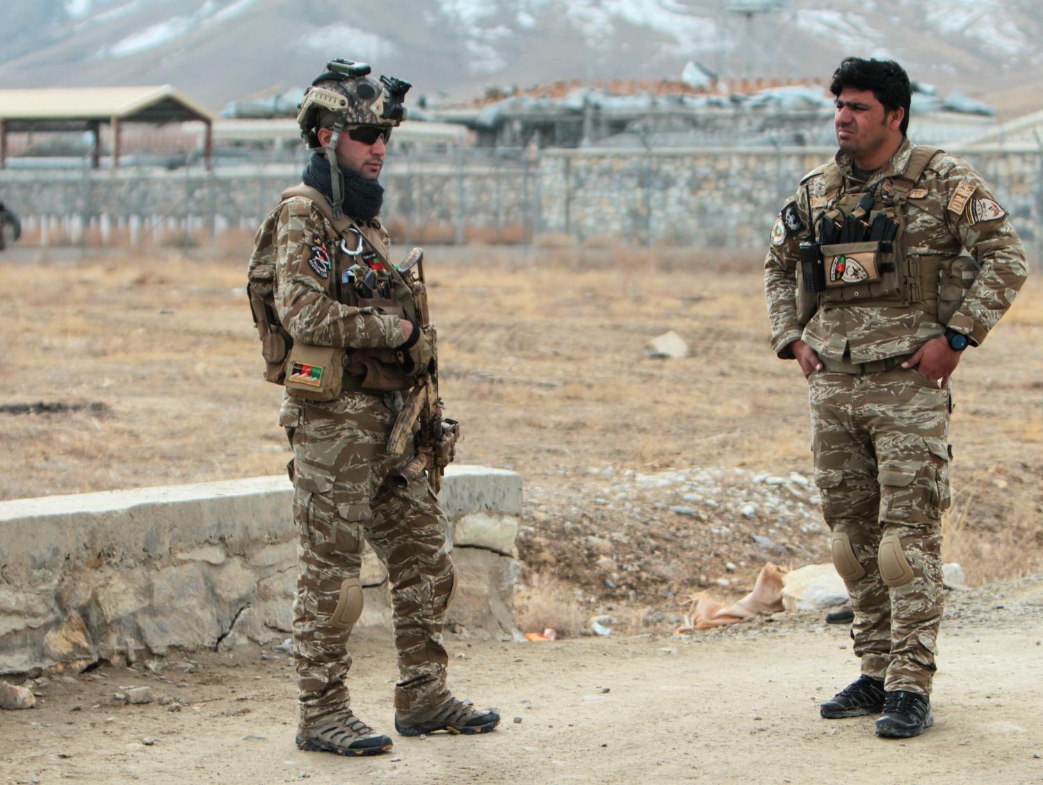 Afghan National Security Forces keep watch outside of a military compound after a car bomb blast on the outskirts of Ghazni city, Afghanistan November 29, 2020. REUTERS/Mustafa Andaleb