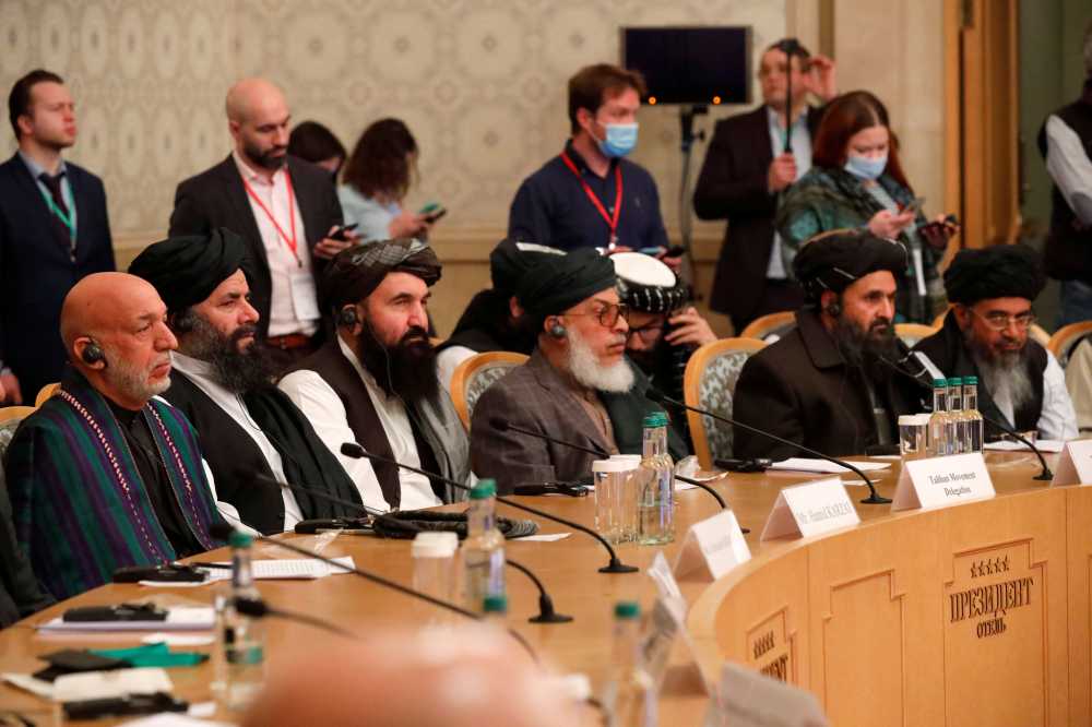Officials, including Afghan former President Hamid Karzai and the Taliban's deputy leader and negotiator Mullah Abdul Ghani Baradar, attend the Afghan peace conference in Moscow, Russia March 18, 2021. Alexander Zemlianichenko/Pool via REUTERS