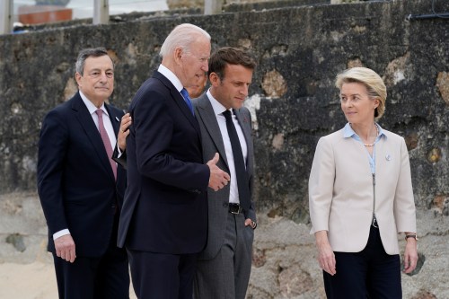 U.S. President Joe Biden walks with Italian Prime Minister Mario Draghi, France's President Emmanuel Macron and European Commission President Ursula von der Leyen after posing for the G-7 family photo with guests at the G-7 summit, in Carbis Bay, Cornwall, Britain June 11, 2021. Patrick Semansky/Pool via REUTERS