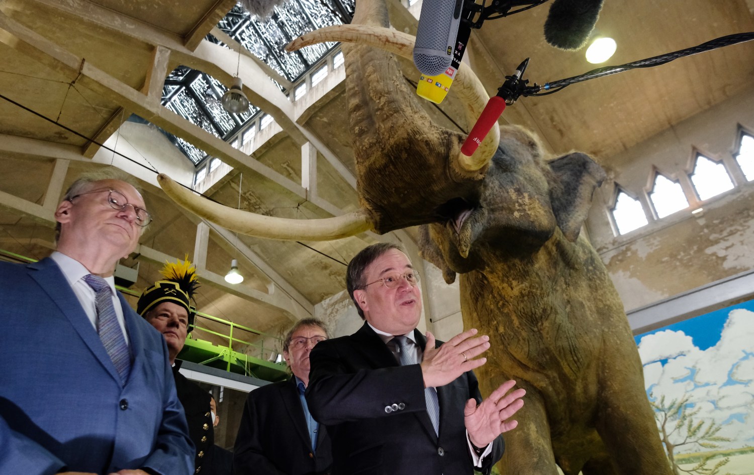 Reiner Haseloff (CDU, l), Minister President of Saxony-Anhalt, stands next to Armin Laschet (CDU), Minister President of North Rhine-Westphalia and candidate for the chancellorship of the CDU/CSU, in front of a model of a forest elephant that lived 200,000 years ago at the Pfännerhall exhibition centre. A new state parliament will be elected in Saxony-Anhalt on 06.06.2021.