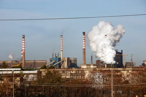 FILE PHOTO: Steam comes out of the chimneys of the Ilva steel plant in Taranto, Italy, November 11, 2019. REUTERS/Ciro De Luca/File Photo