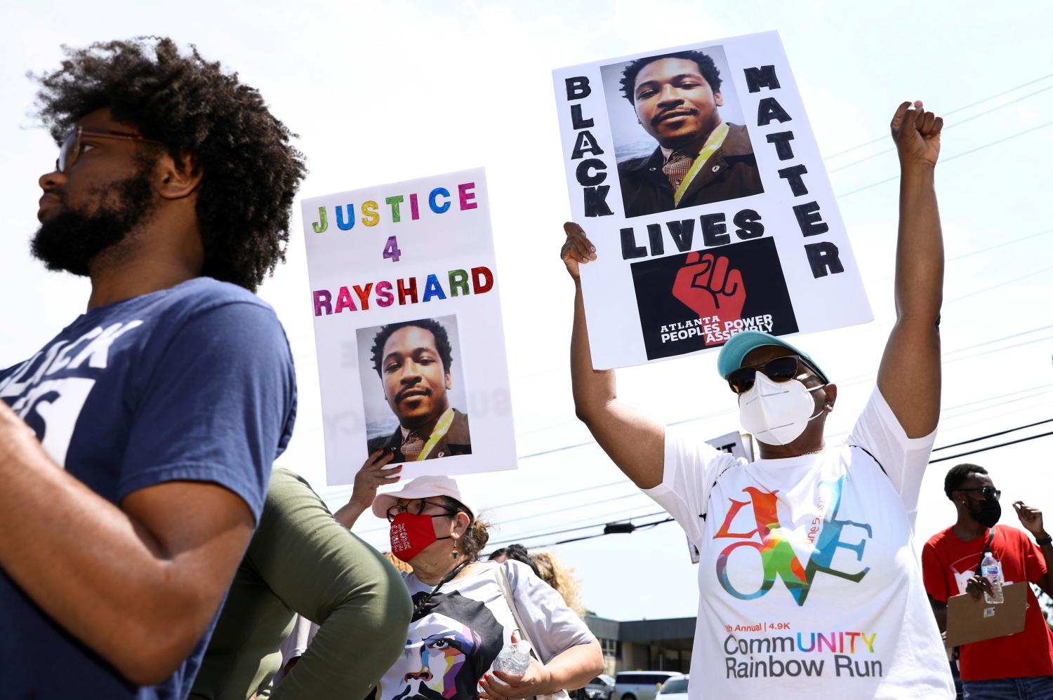 People attend a rally for racial justice on the one year anniversary of the police shooting of Rayshard Brooks, in Atlanta, Georgia, U.S., June 12, 2021.  REUTERS/Dustin Chambers     TPX IMAGES OF THE DAY