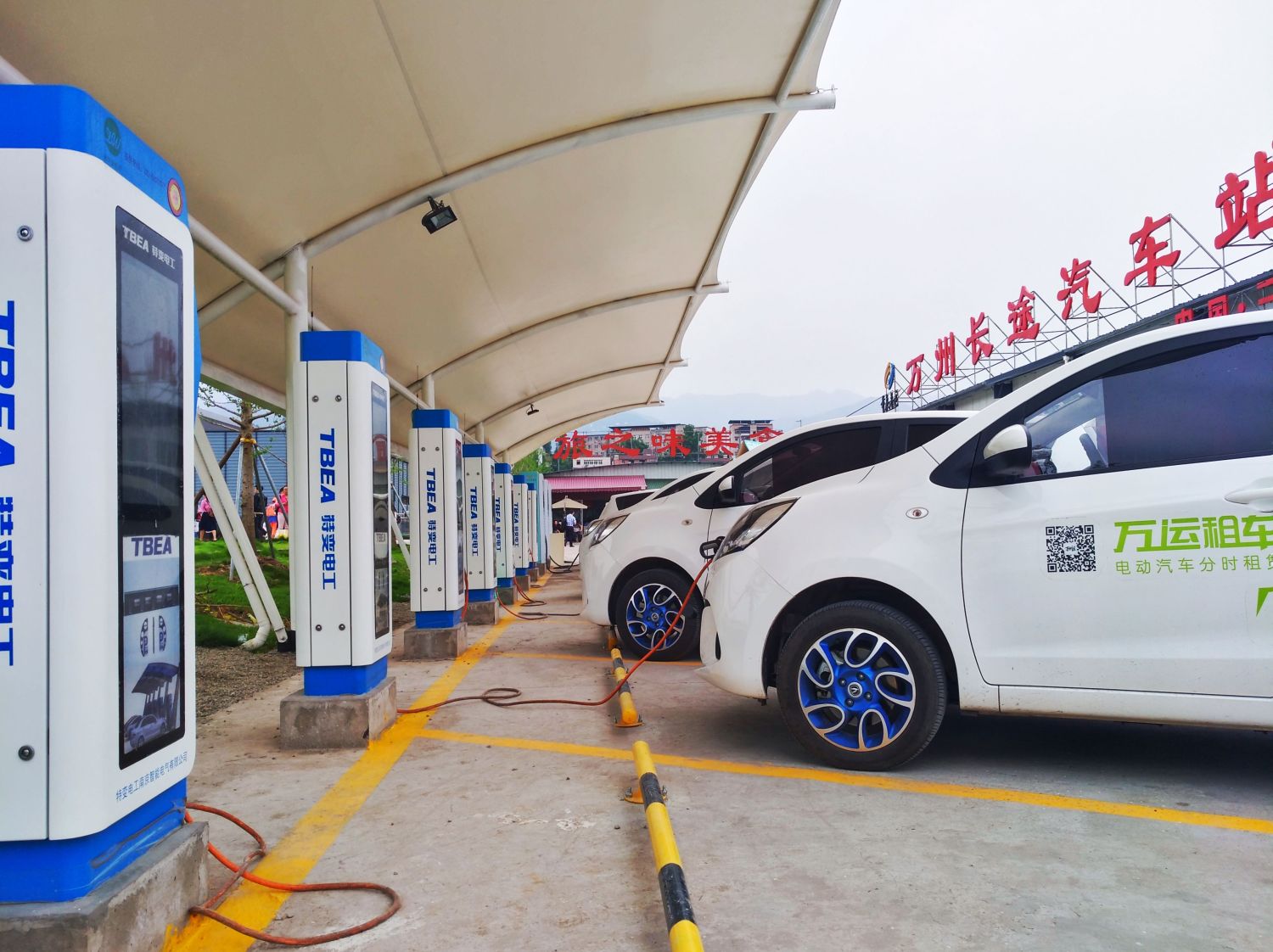 Chongqing, China – May 28, 2018: New Energy Electric Vehicle, New Energy Vehicle Charging at Charging Station Using Charging Pole