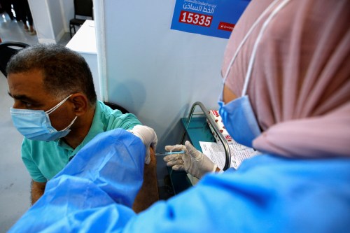 A man receives a dose of the China's Sinopharm vaccine against the coronavirus disease (COVID-19) at a mass immunization venue inside Cairo's International Exhibition Center in Cairo, Egypt June 5, 2021. REUTERS/Amr Abdallah Dalsh