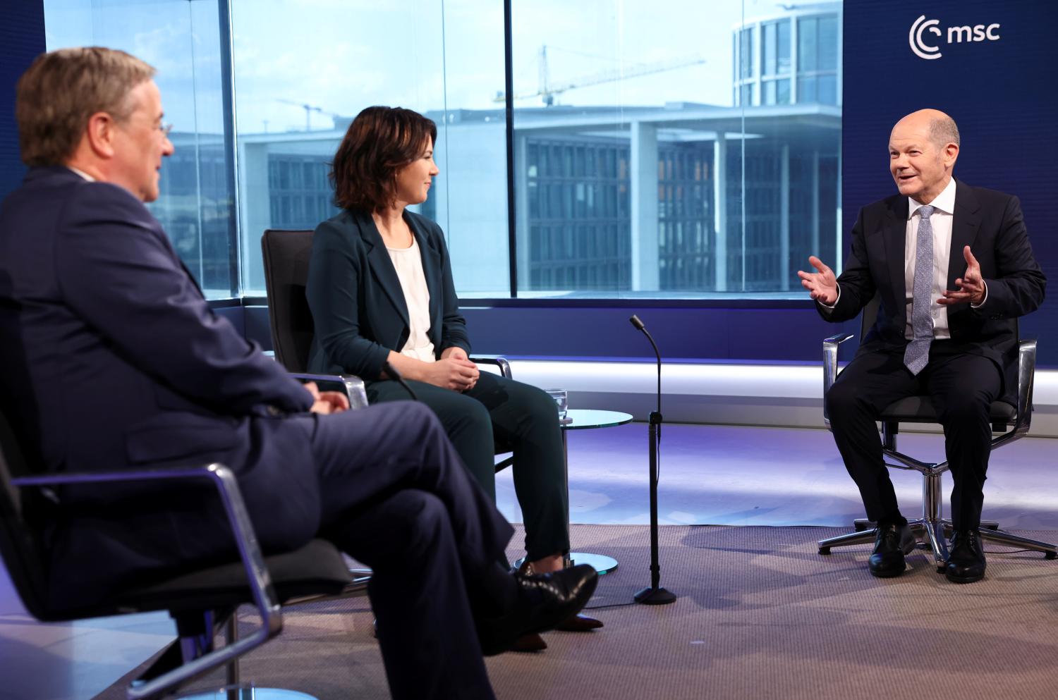 German Christian Democratic Union (CDU) leader Armin Laschet, Green party co-leader Annalena Baerbock and German Finance Minister Olaf Scholz of the Social Democratic Party (SPD) attend a television debate in Berlin, Germany, June 26, 2021. REUTERS/Christian Mang/Pool