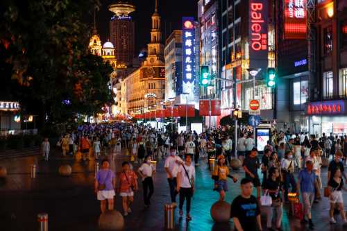 People visit a main shopping area in Shanghai, China July 12, 2021. Picture taken July 12, 2021. REUTERS/Aly Song