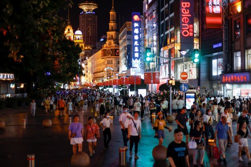 People visit a main shopping area in Shanghai, China July 12, 2021. Picture taken July 12, 2021. REUTERS/Aly Song