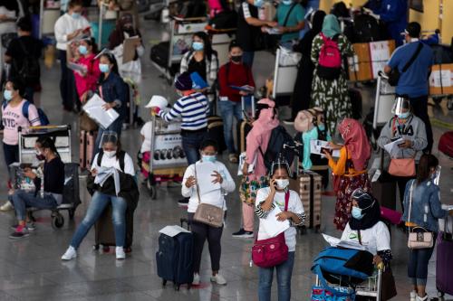 Passengers, mostly Overseas Filipino Workers (OFW) queue at the departure area of Ninoy Aquino International Airport amid the coronavirus disease (COVID-19) outbreak, in Pasay, Metro Manila, Philippines, June 1, 2021. REUTERS/Eloisa Lopez