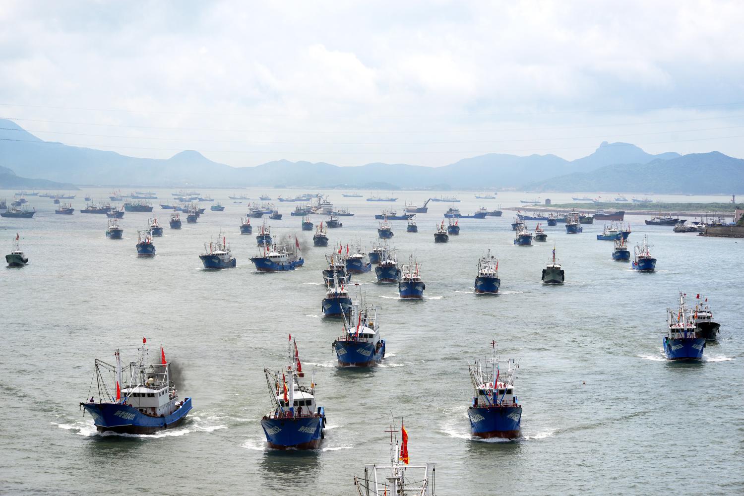 --FILE--A fishing fleet departs from a harbor after the summer fishing moratorium ended in Zhoushan city, east China's Zhejiang province, 1 August 2016.Overfishing in Chinese rivers and seas has seriously depleted stocks and the government is to cut the size of the nation's fishing fleet, the agricultural ministry said. The ministry said there were practically "no fish" in the coastal East China Sea and fishermen also had a hard time finding a catch in many other coastal waters, according to a state radio report on Sunday (14 August 2016). Agriculture minister Han Changfu told China National Radio that it was time to trim China's fishing industry, now booming with the world's largest fishing fleet, to protect fish stocks.No Use China. No Use France.