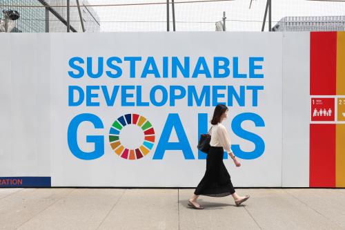 A woman wearing a mask as a preventive measure against the spread of covid-19 walks past a sign advertising UN's 'Sustainable development goals' in Ginza.The State of Emergency in Tokyo will last until end of June 2021. (Photo by Stanislav Kogiku / SOPA Images/Sipa USA)No Use Germany.