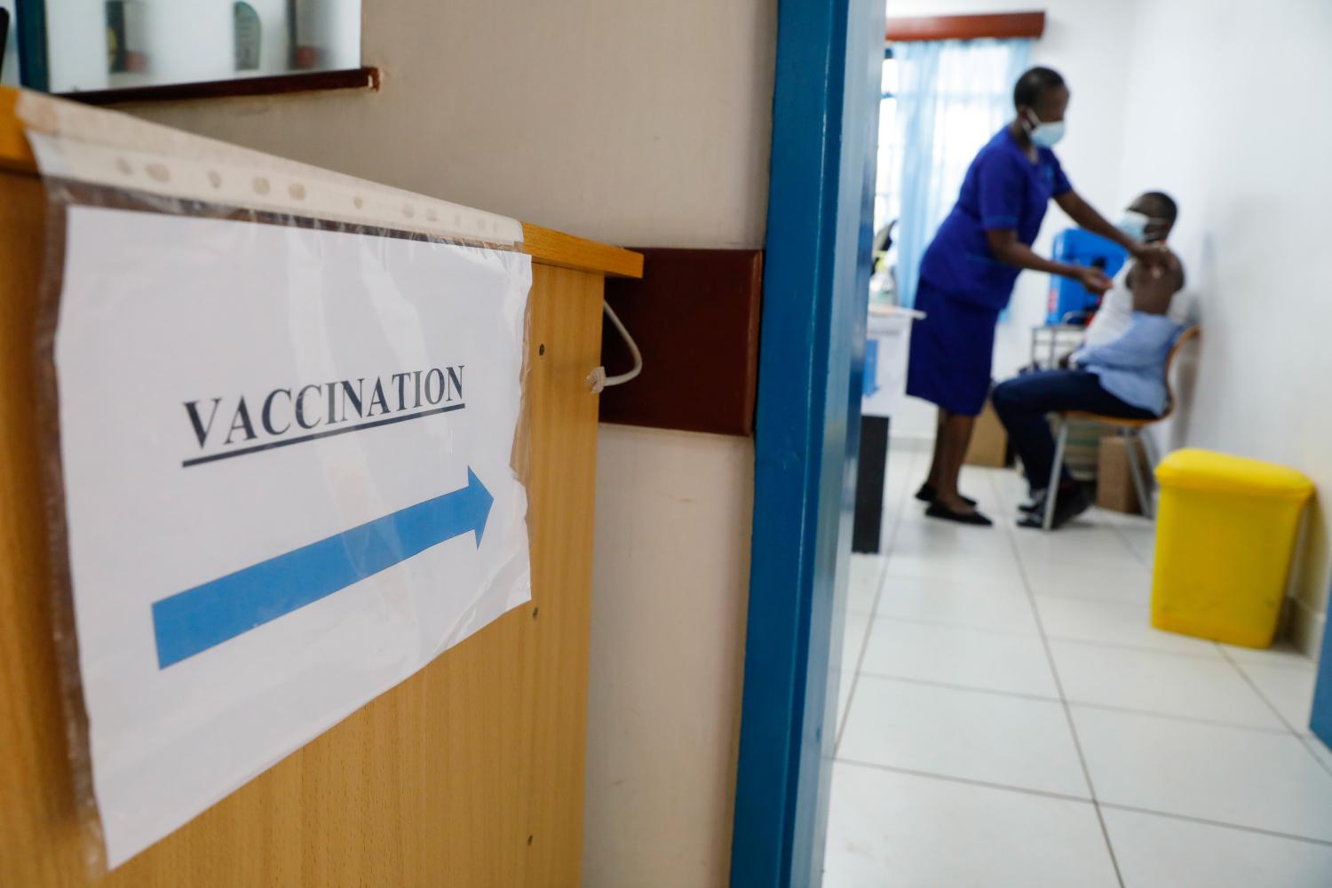 A medical worker gives a dose of AstraZeneca's coronavirus disease (COVID-19) vaccine to a man, at the Ruaraka Uhai Neema Hospital in Nairobi, Kenya, April 8, 2021. REUTERS/Baz Ratner