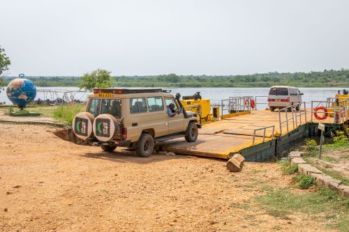 Murchison Falls national park / Uganda - February 20 2020: Ferry crossing the Nile river to bring the safari tourists to the other side.