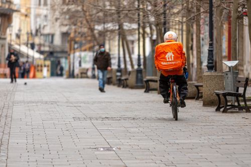 Bucharest, Romania 03-18-2021: Take Away Delivery on bike