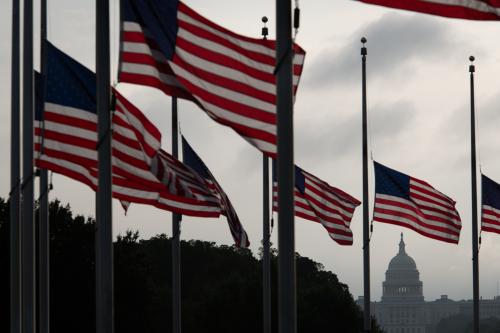 A general view of the U.S. Capitol Building as seen behind American flags flying at half staff near the Washington Monument in Washington, D.C., on September 11, 2020, amid the coronavirus pandemic. On the 19th anniversary of 9/11, Democratic Candidate for President Joe Biden visited the site of the attacks in New York City for a commemoration before heading to the Shanksville, PA, memorial where President Trump will also visit - across the country flags were flown at half staff. (Graeme Sloan/Sipa USA)No Use UK. No Use Germany.