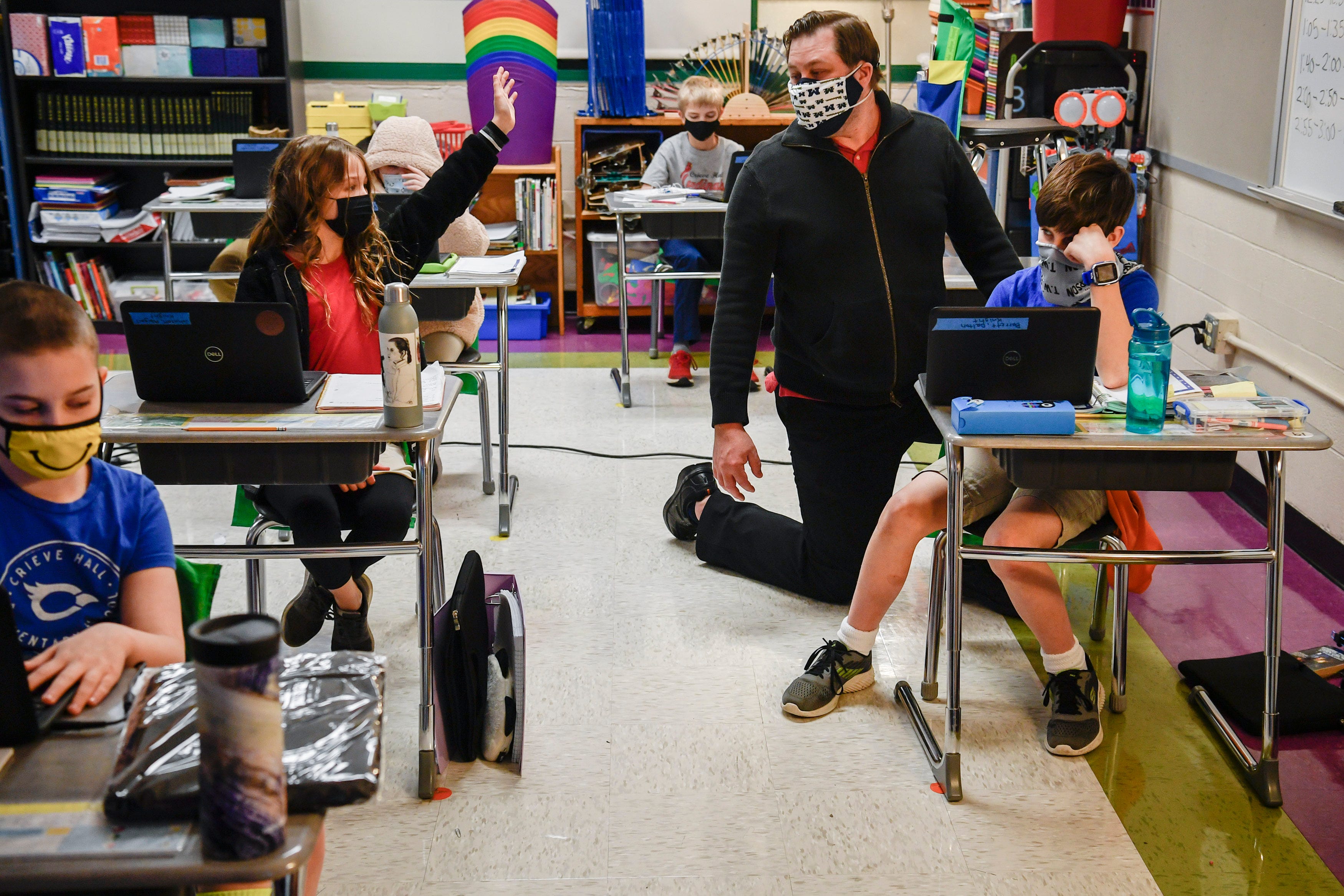Fourth Grade Teacher Kenneth Knight assists students in connecting to the internet on the first day back to in-person learning at Crieve Hall Elementary School on Tuesday, Feb. 9, 2021 in Nashville, Tenn.Metro Nashville Public Schools Students Return In Person Jn 014
