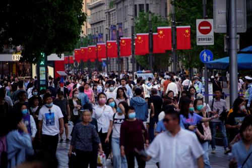 People walk along Nanjing Pedestrian Road, a main shopping area, following the outbreak of the coronavirus disease (COVID-19), in Shanghai, China May 10, 2021. REUTERS/Aly Song