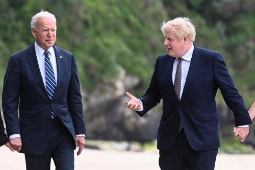 Britain's Prime Minister Boris Johnson speaks with U.S. President Joe Biden while they walk with their wife Carrie Johnson (not seen) and U.S. first lady Jill Biden (not seen), outside Carbis Bay Hotel, Carbis Bay, Cornwall, Britain June 10, 2021. REUTERS/Toby Melville/Pool