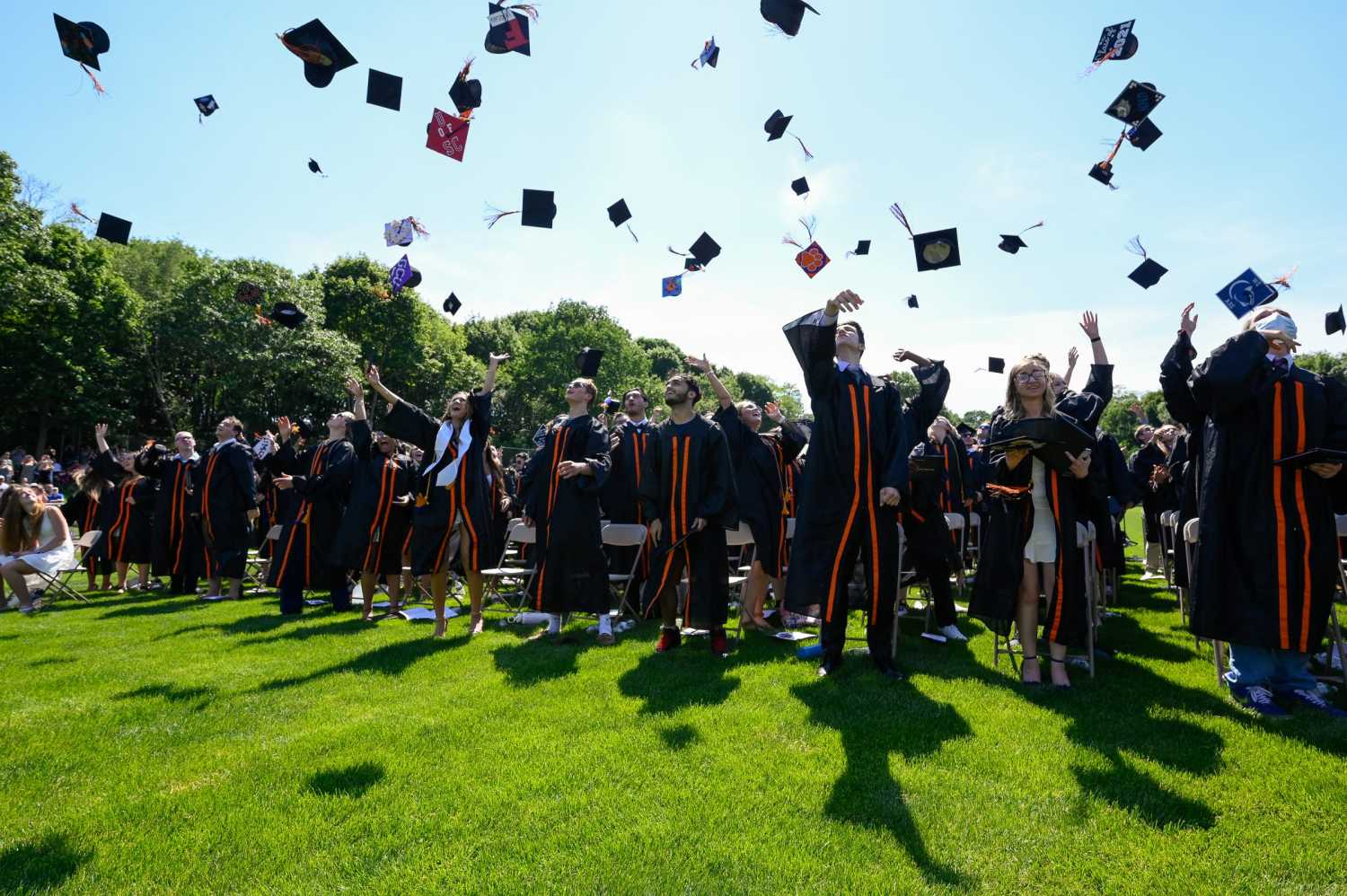 Graduates toss their caps into the air at the conclusion of the Beverly High School class of 2021 graduation ceremony at Hurd Stadium on Sunday, June 6, 2021.7617140002p Bev Graduation23ds