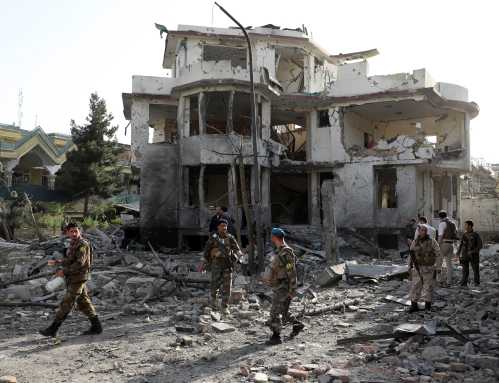 Afghan National Army (ANA) soldiers keep watch a the site of yesterday's night-time car bomb blast in Kabul, Afghanistan August 4, 2021. REUTERS/Stringer