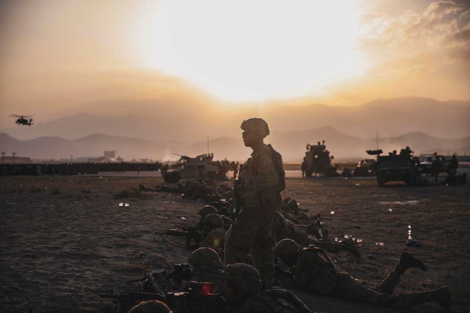 U.S. Army Soldiers assigned to the 10th Mountain Division stand security at Hamid Karzai International Airport, Kabul, Afghanistan, in this photo taken on August 15, 2021 and released by U.S. Navy on August 18, 2021. U.S NAVY/Central Command Public Affairs/Sgt. Isaiah Campbell/Handout via REUTERS