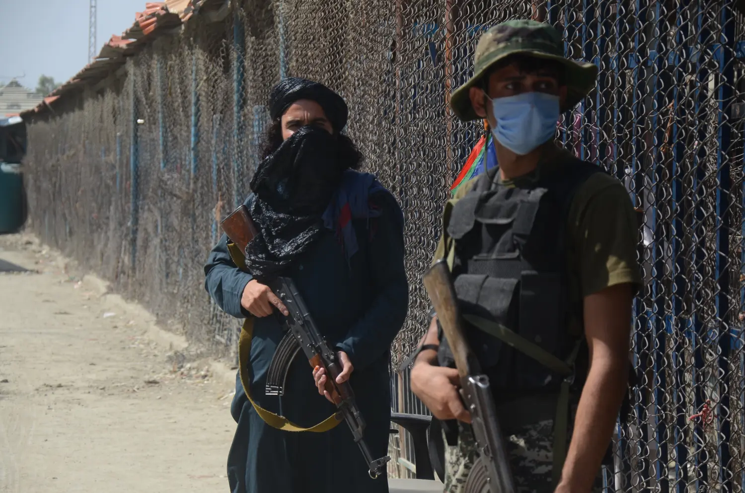 Taliban fighters stand guard on their side at a border crossing point between Pakistan and Afghanistan, in Torkham, in Khyber district, Pakistan, Saturday, Aug. 21, 2021. In the current situation of Afghanistan, pedestrian movement has been limited in Torkham border, only stranded people on both sides and trucks taking goods to Afghanistan can pass through this border point. (Photo by Hussain Ali/Pacific Press/Sipa USA)No Use Germany.