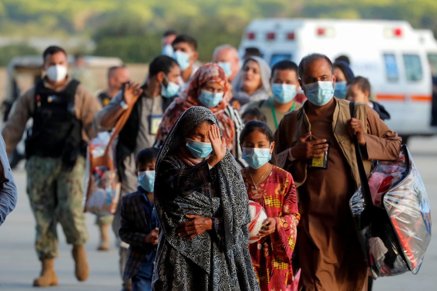 Afghan citizens, who have been evacuated from Kabul, arrive at Naval Station (NAVSTA) Rota Air Base in Rota, southern Spain, August 31, 2021. REUTERS/Jon Nazca