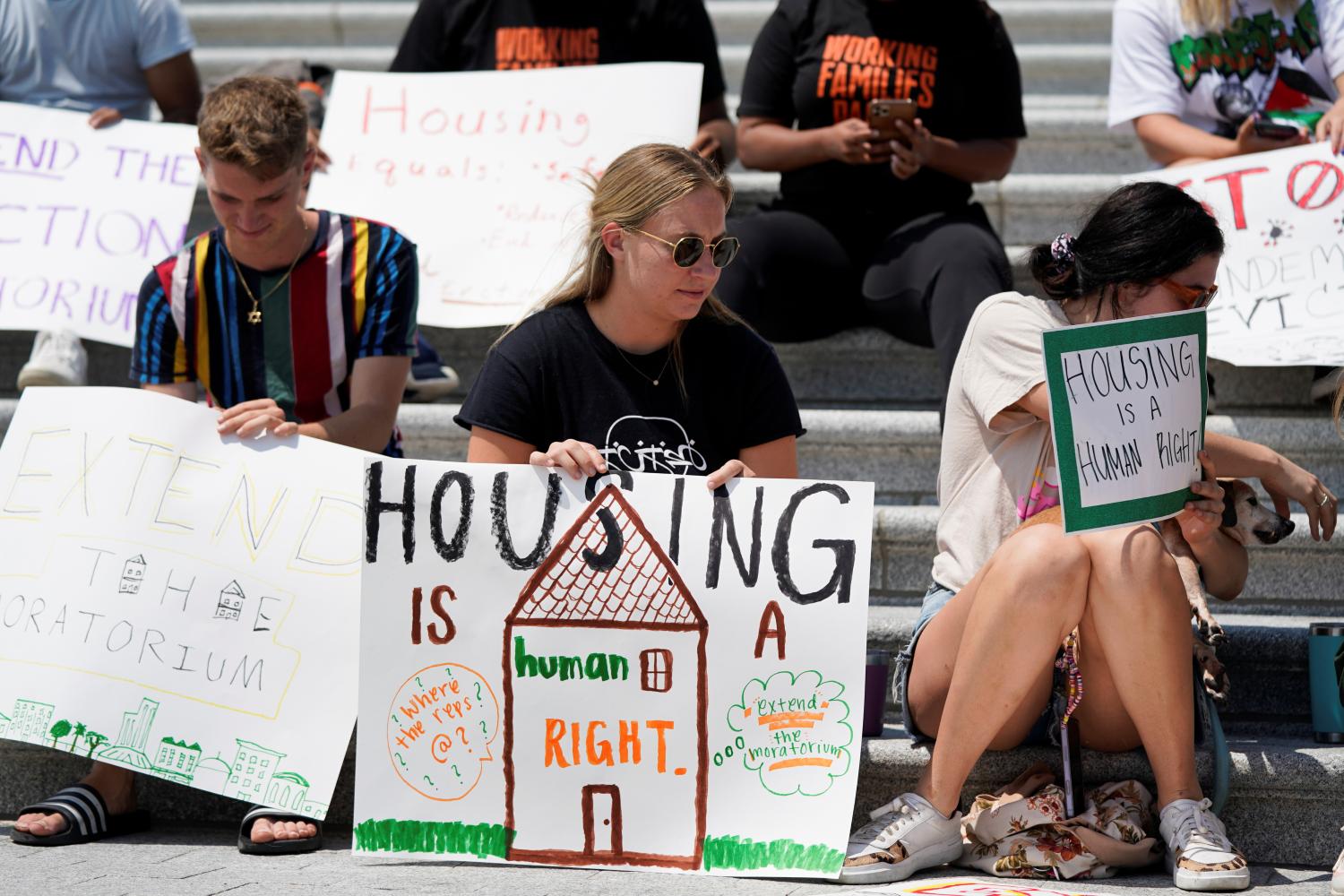 People camp out on the steps of the U.S. Capitol to highlight the upcoming expiration of the pandemic-related federal moratorium on residential evictions, in Washington, U.S., July 31, 2021. REUTERS/Elizabeth Frantz