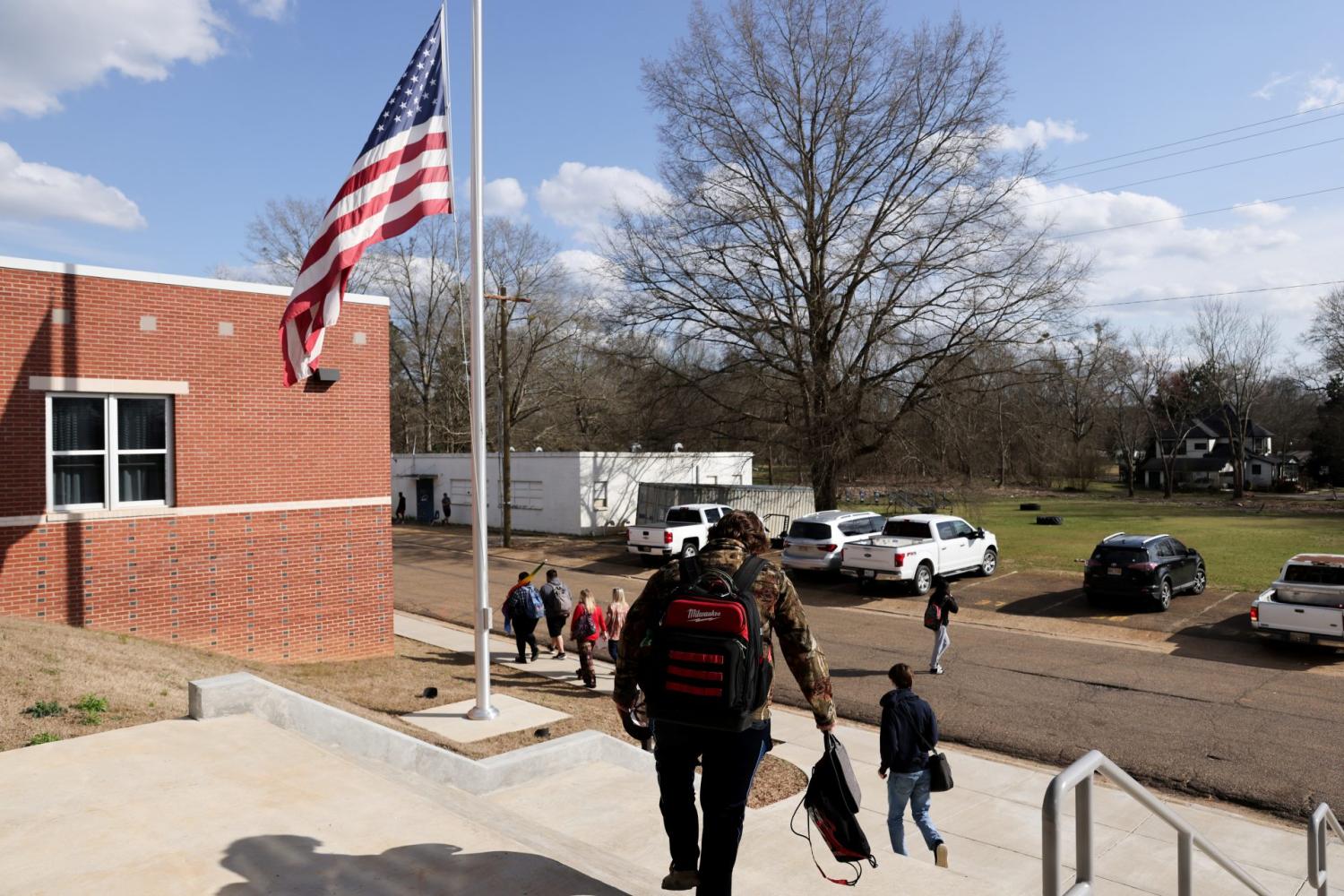 Students depart for spring break at the end of an in-person school day at Choctaw County High School in Ackerman, Mississippi, U.S. March 11, 2021. In rural Choctaw County, Mississippi, a recent lull in Covid cases and ongoing vaccination campaigns are giving many members of the community a sense of optimism about the yearlong coronavirus disease (COVID-19) pandemic as Mississippi and surrounding states have announced that they are rescinding  mask mandates and other coronavirus restrictions. Picture taken March 11, 2021. REUTERS/Jonathan Ernst