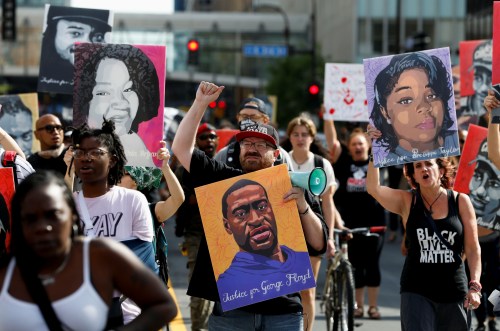 Protesters march during a brief rally after the sentencing of Derek Chauvin, the former Minneapolis policeman found guilty of killing George Floyd, a Black man, in Minneapolis, Minnesota, U.S. June 25, 2021. REUTERS/Eric Miller
