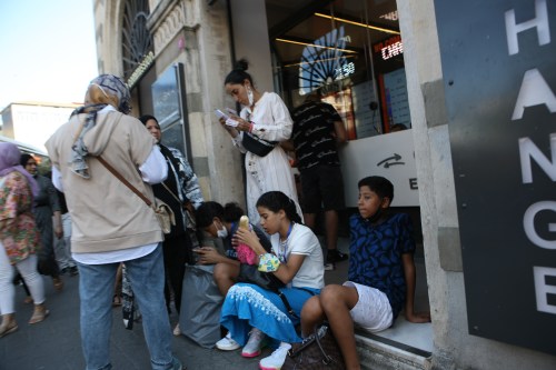 Members of a Syrian family stand in front of a currency exchange office in Istanbul, Turkey, on Sunday, August 8, 2021. Thousands of Afghans have been forced to flee to Turkey through Iran following U.S.' withdrawal from Afghanistan and the Taliban's advance in the provinces. Turkey currently hosts over 3.5 million Syrian refugees in addition to the Afghans and other countries. (Photo by Ilker Eray/GocherImagery/Sipa USA)No Use Germany.