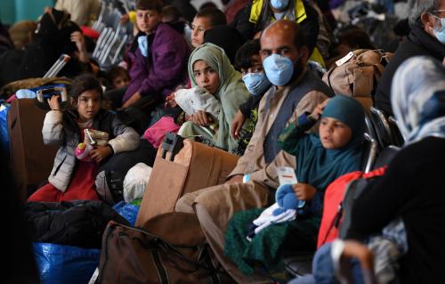 Afghan refugees are processed inside Hangar 5 at Ramstein Air Base in Germany, September 8, 2021. Olivier Douliery / Pool via REUTERS