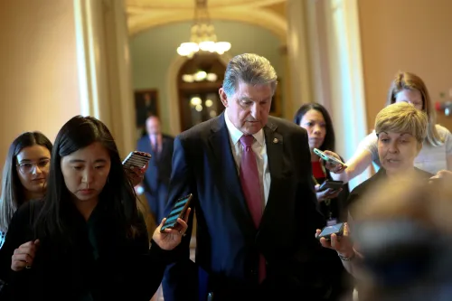 FILE PHOTO: Senator Joe Manchin (D-WV) speaks to news reporters before attending a meeting on infrastructure on Capitol Hill in Washington, U.S., June 23, 2021.  REUTERS/Tom Brenner/File Photo