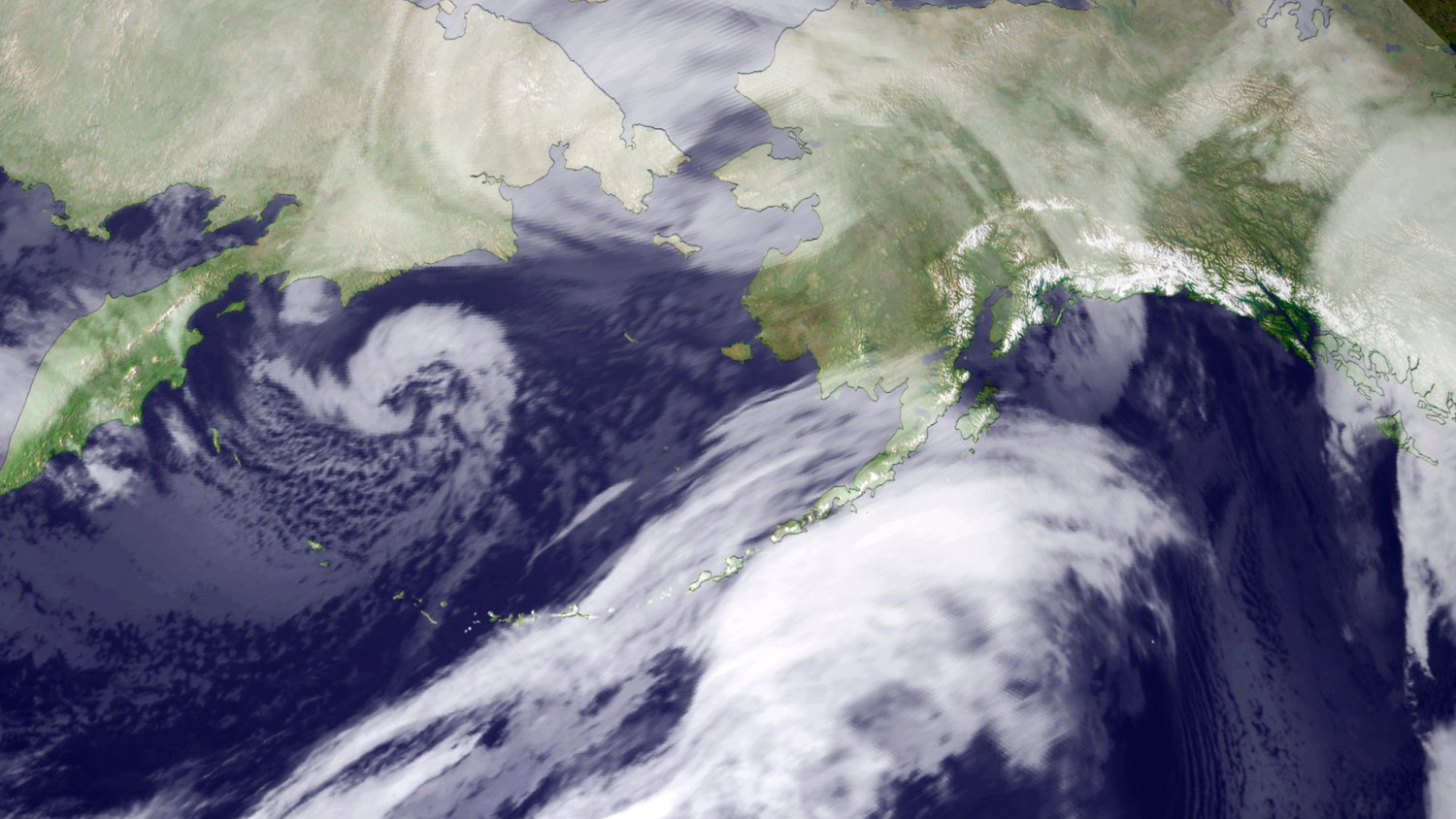 This composite infrared imagery from NOAA weather satellites taken November 9, 2011 shows the storm moving over the Bering Strait region, bringing heavy winds and flooding to western Alaska. The storm, moving inland from the Aleutian Islands, was expected to bring hurricane-force winds with gusts up to 100 miles per hour, heavy snowfall, widespread coastal flooding and severe erosion to most of Alaska's west coast, the National Weather Service said. REUTERS/NOAA/Handout (UNITED STATES - Tags: ENVIRONMENT)