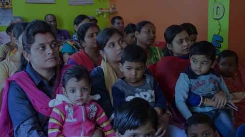 Parents and children in a school in India