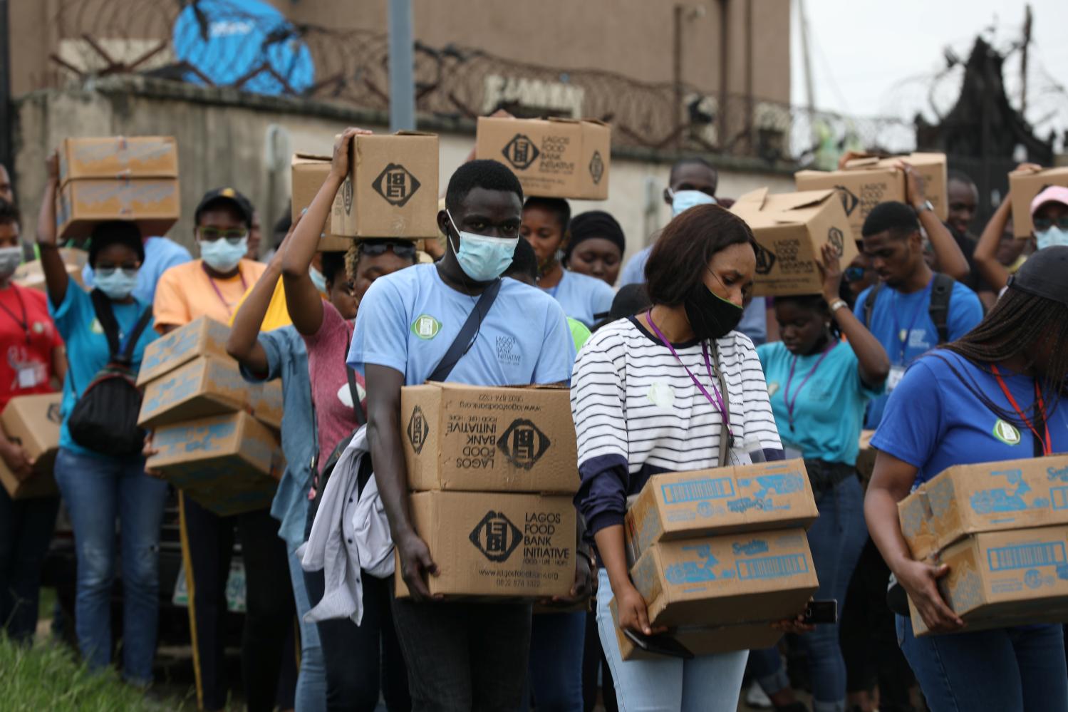 Volunteers of the Lagos food bank initiative prepare for a food aid distribution in a community in Oworoshoki, Lagos, Nigeria July 10, 2021. Picture taken July 10, 2021. REUTERS/Temilade Adelaja