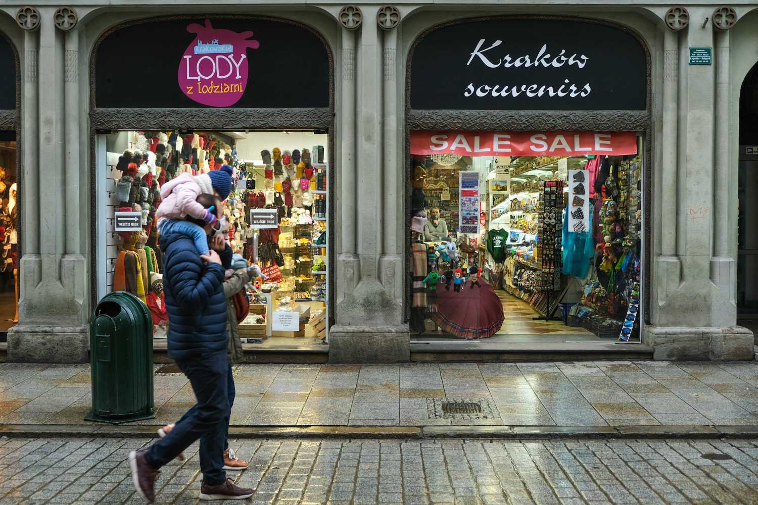 A woman wearing a mask as a preventive measure against the spread of covid-19 walks past Souvenir shops.Poland is now passing for the second wave of Coronavirus and life continues under restrictive measures such as the closure of stores inside shopping malls, gatherings with a maximum of 5 people, bars and restaurants operating on a take away. Poland has registered more than one million COVID-19 infections and the death toll above 25000. (Photo by Omar Marques / SOPA Images/Sipa USA)No Use UK. No Use Germany.