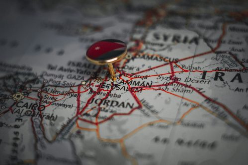 Amman pinned on a map with the flag of Jordan