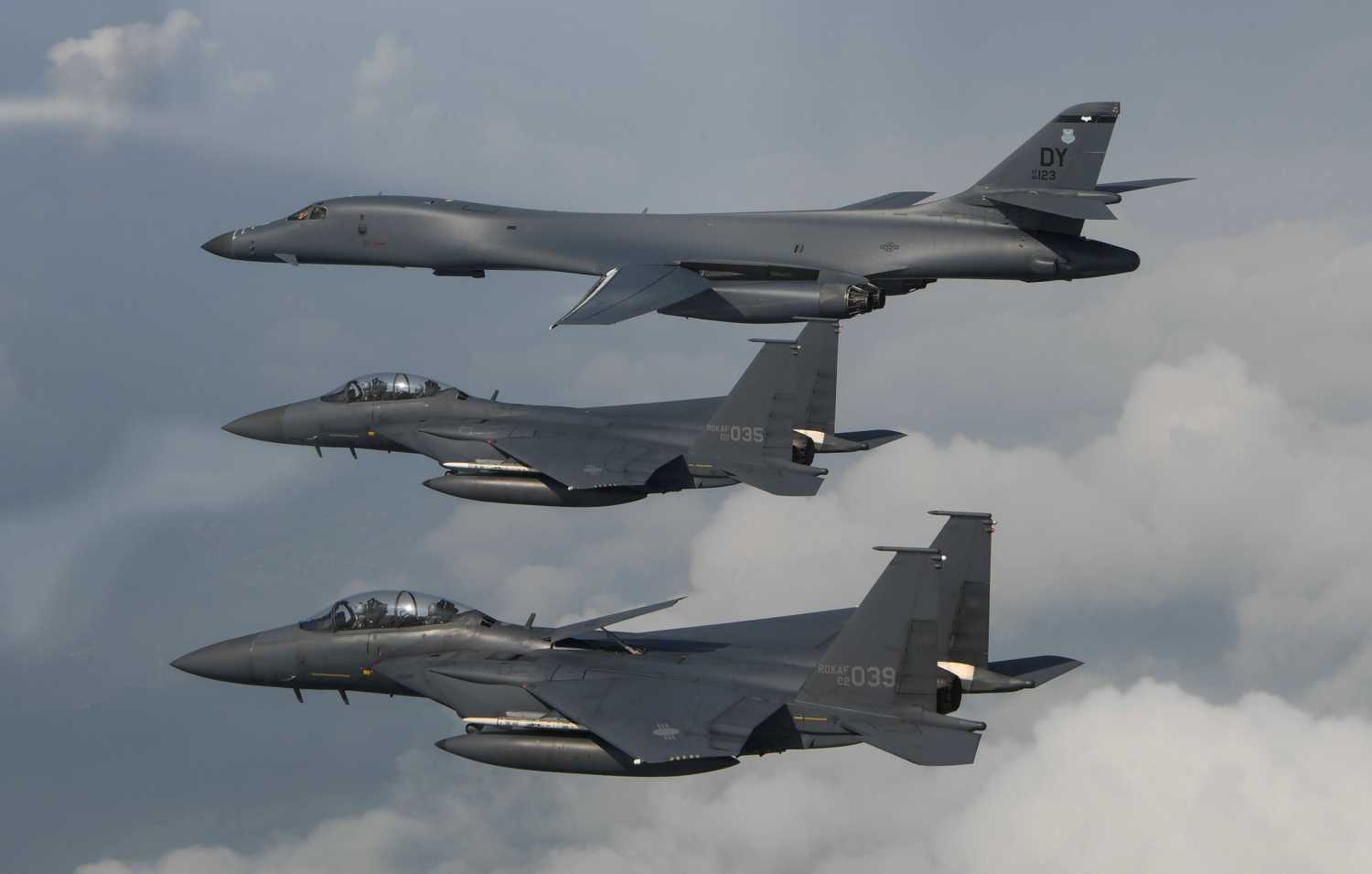 A U.S. Air Force B-1B Lancer assigned to the 9th Expeditionary Bomb Squadron, deployed from Dyess Air Force Base, Texas, is joined by Republic of Korea air force F-15s, during a 10-hour mission from Andersen Air Force Base, Guam, into Japanese airspace and over the Korean Peninsula, July 30, 2017.  Photo taken July 30, 2017.  Tech. Sgt. Kamaile Casillas/Pacific Air Forces/DVIDS/Handout via REUTERS   ATTENTION EDITORS - THIS IMAGE WAS PROVIDED BY A THIRD PARTY