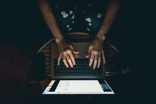 A women sitting on her couch is working from home due to the confinement due to the corona virus pandemy. Paris, France. April 10 2020.Une femme assise sur son canape fait du teletravail en raison du confinement pendant la pandemie de coronavirus. Paris, France. 10 avril 2020.NO USE FRANCE