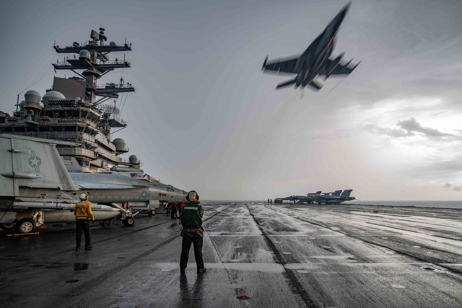 Hand out photo dated July 4, 2020 of an F/A-18E Super Hornet flies over the flight deck of the Navys only forward-deployed aircraft carrier USS Ronald Reagan (CVN 76), maintaining Ronald Reagans tactical presence on the seas. Ronald Reagan is the flagship of Carrier Strike Group (CSG) 5. Two US aircraft carriers have carried out drills in the South China Sea, a US Navy spokesman said Saturday, after the Pentagon expressed concerns over Chinese military exercises around a disputed archipelago. The USS Nimitz and USS Ronald Reagan conducted dual carrier operations in the waterway to "support a free and open Indo-Pacific," the spokesman said. China's expanding military presence in the contested waters has worried several of its neighbours. U.S. Navy photo by Mass Communication Specialist 2nd Class Samantha Jetzer via ABACAPRESS.COM