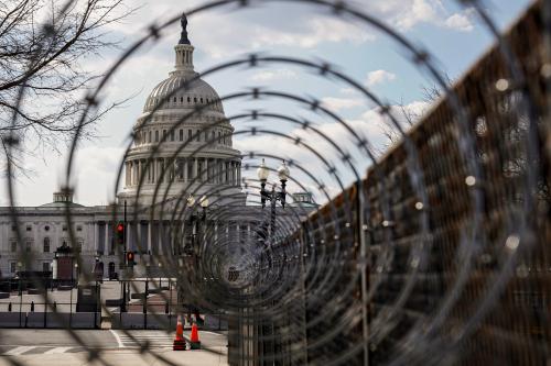 The U.S. Capitol is seen through razor wire after police warned that a militia group might try to attack the U.S. Capitol in Washington, U.S., March 4, 2021. REUTERS/Joshua Roberts