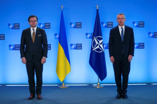 NATO Secretary General Jens Stoltenberg and Ukrainian Foreign Minister Dmytro Kuleba pose for a photo prior to a meeting at NATO headquarters in Brussels, Belgium, April 13, 2021. Francisco Seco/Pool via REUTERS