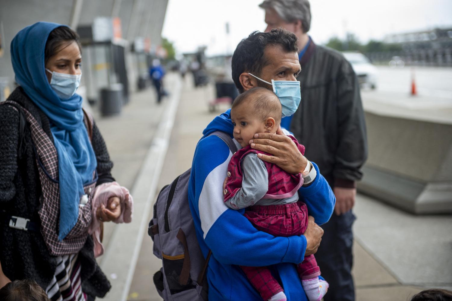 Refugees evacuated from Afghanistan arrive at Washington Dulles International Airport and make their way to a waiting bus in Chantilly, VA, USA, Wednesday, September 1, 2021. Photo by Rod Lamkey/CNP/ABACAPRESS.COM